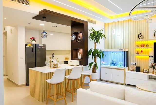 Town Square — Nshama, Dubai: kitchen island with aquarium feature